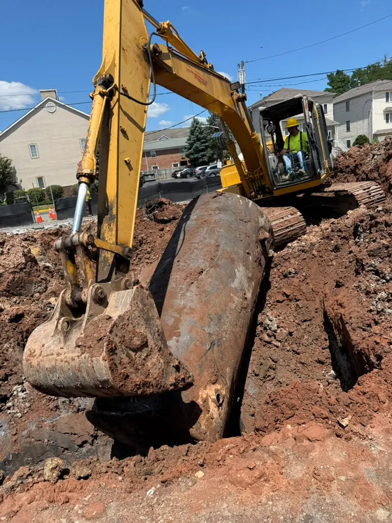 Excavator digging on a job site